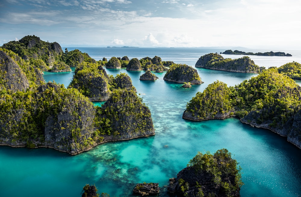 an aerial view of a body of water surrounded by rocks