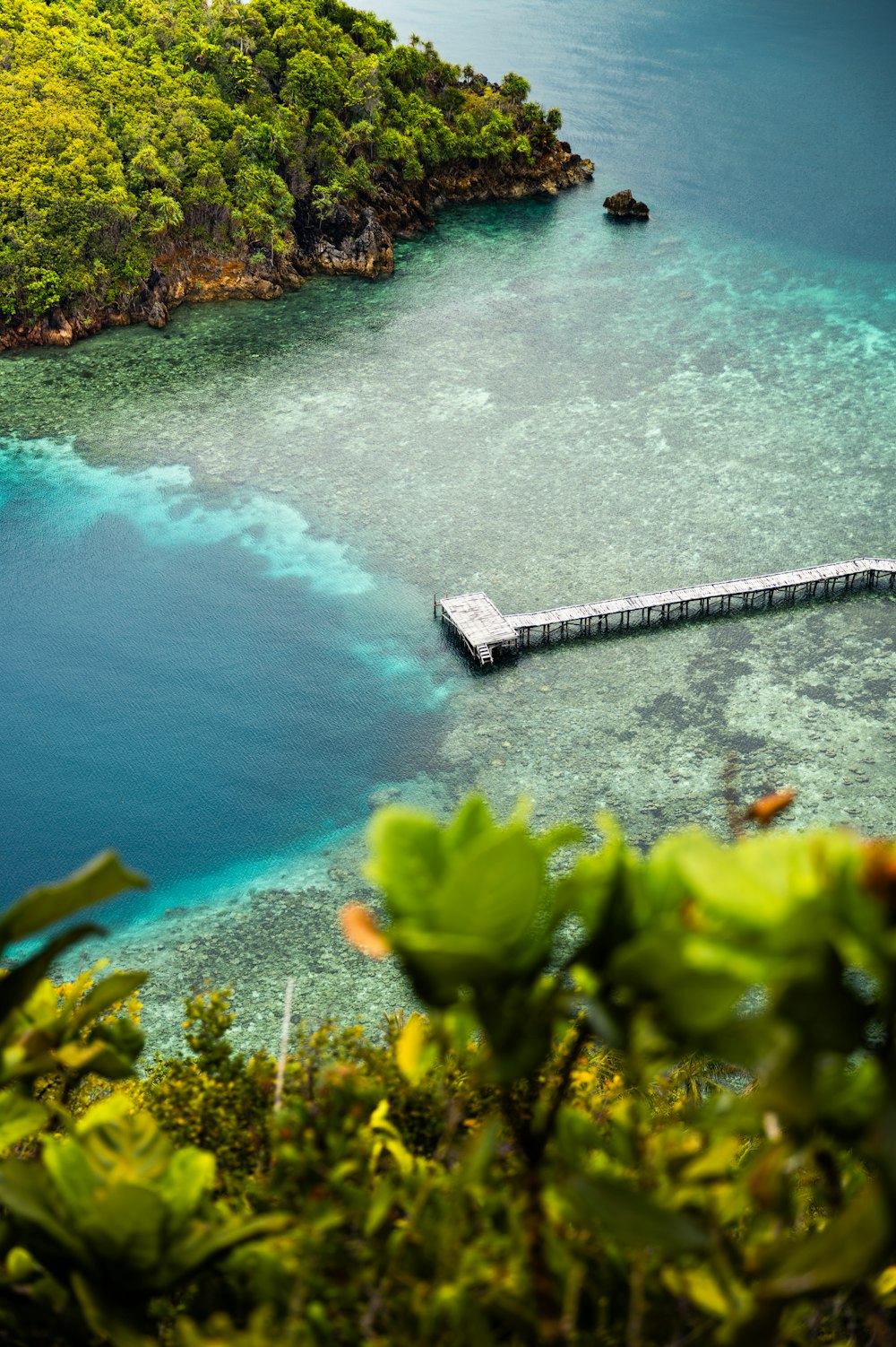 a pier in the middle of a body of water