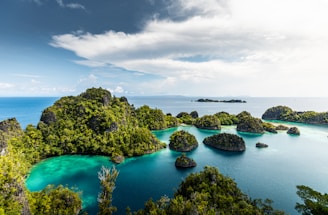 a group of small islands in the middle of a body of water