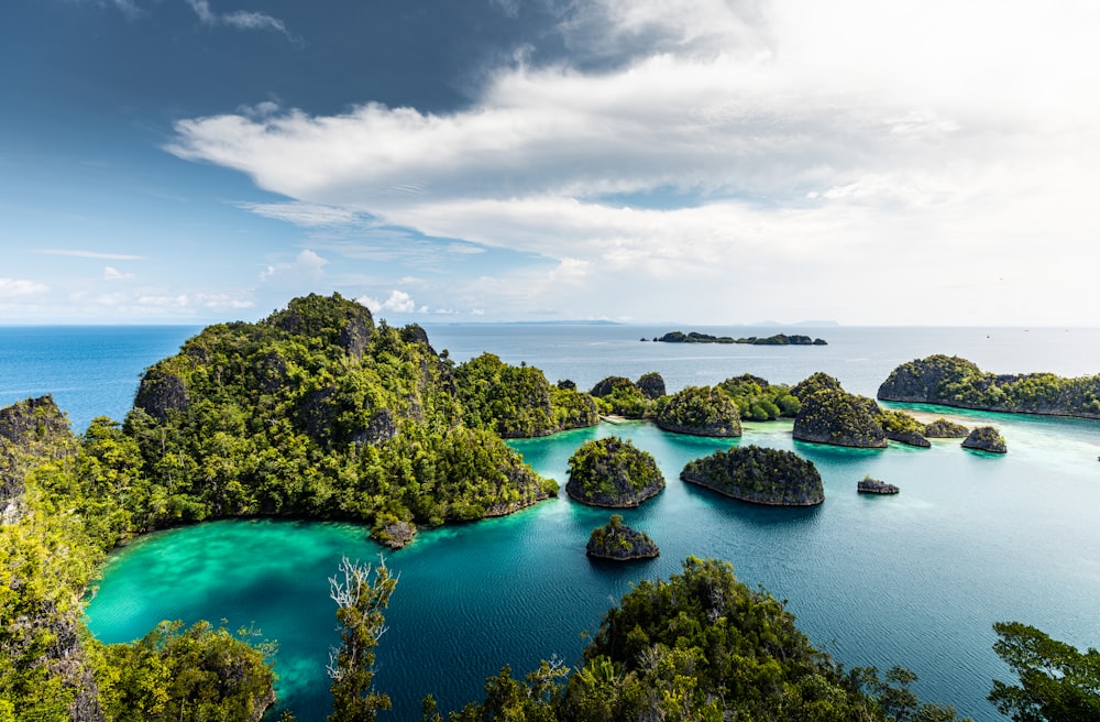 a group of small islands in the middle of a body of water