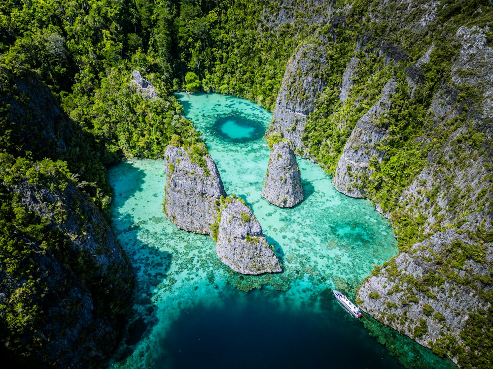 an aerial view of a river surrounded by mountains