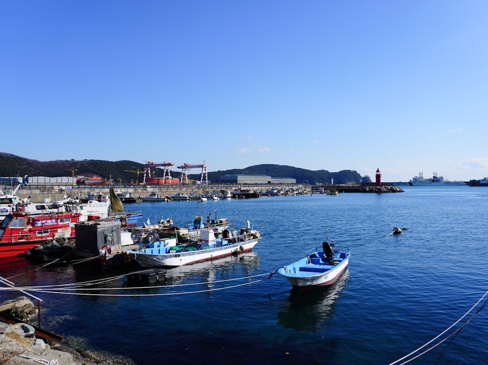 a group of boats floating on top of a body of water