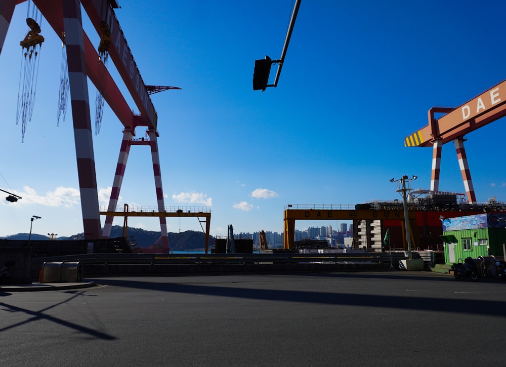 a large crane sitting on top of a road next to a traffic light