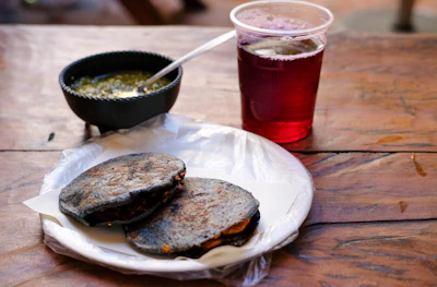 Traditional Navajo breakfast spread featuring blue corn mush and herb coffee on rustic pottery