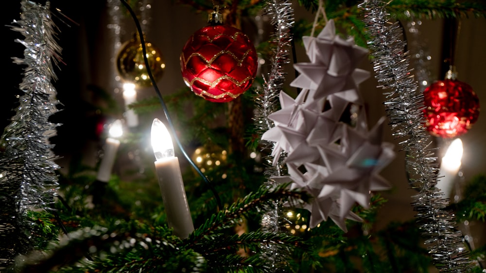 a close up of a christmas tree with ornaments