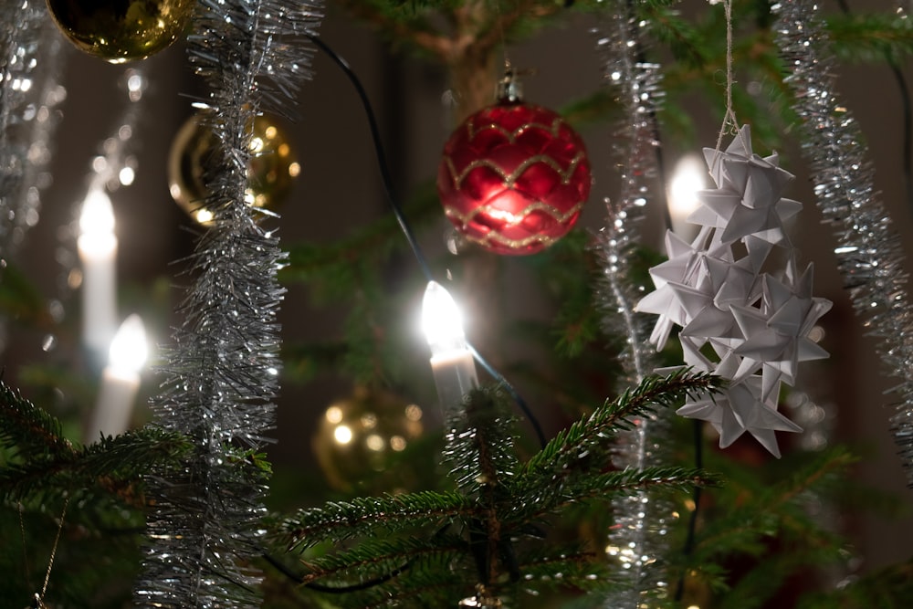 a close up of a christmas tree with ornaments