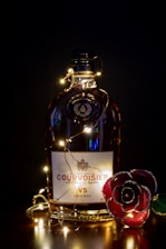 Close-up of a vintage Jean-Luc Pasquet Cognac bottle with elegant label in warm lighting.
