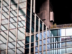 Close-up of sleek, transparent balcony glazing reflecting the Brabant skyline