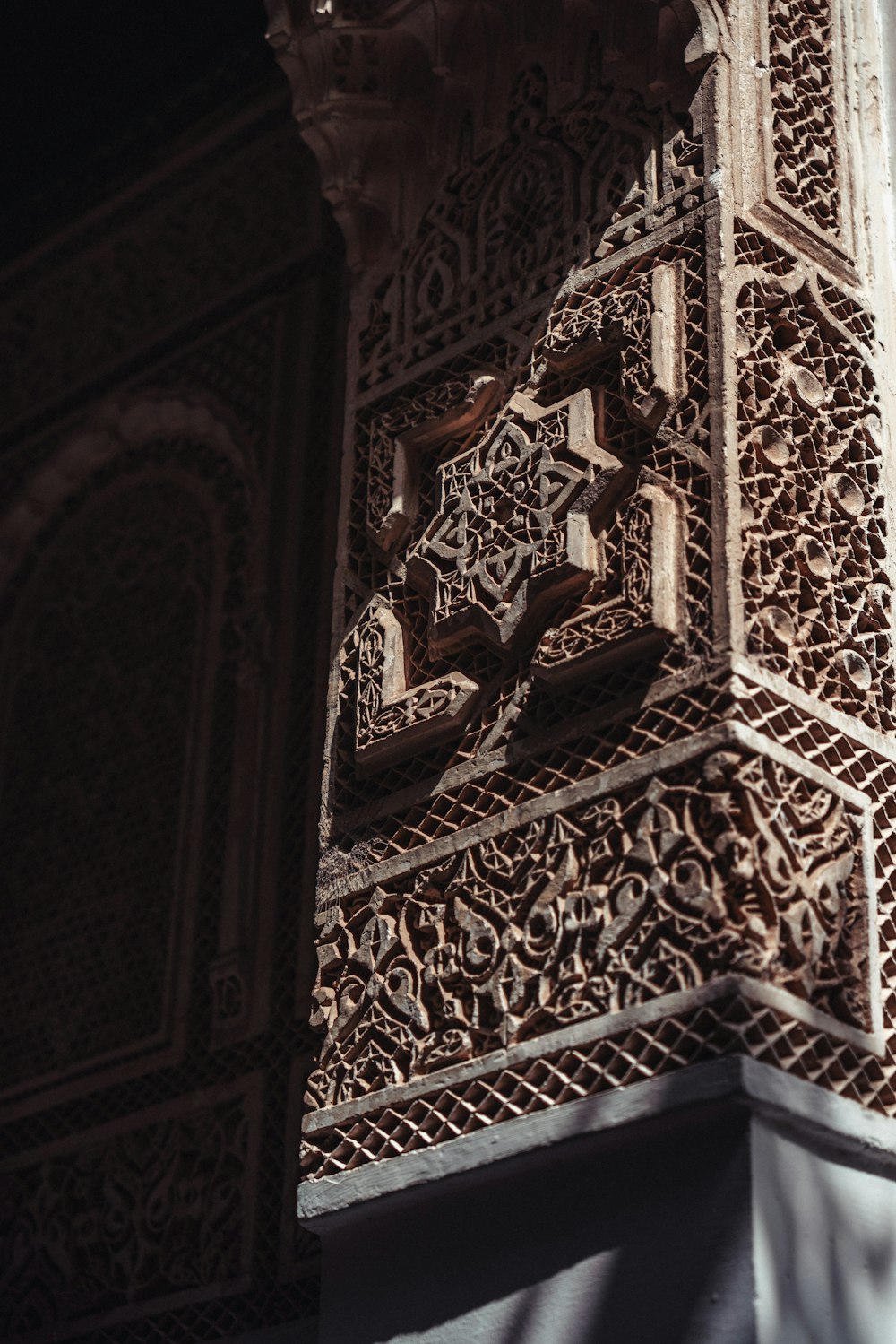 a close up of a building with a clock on it's side