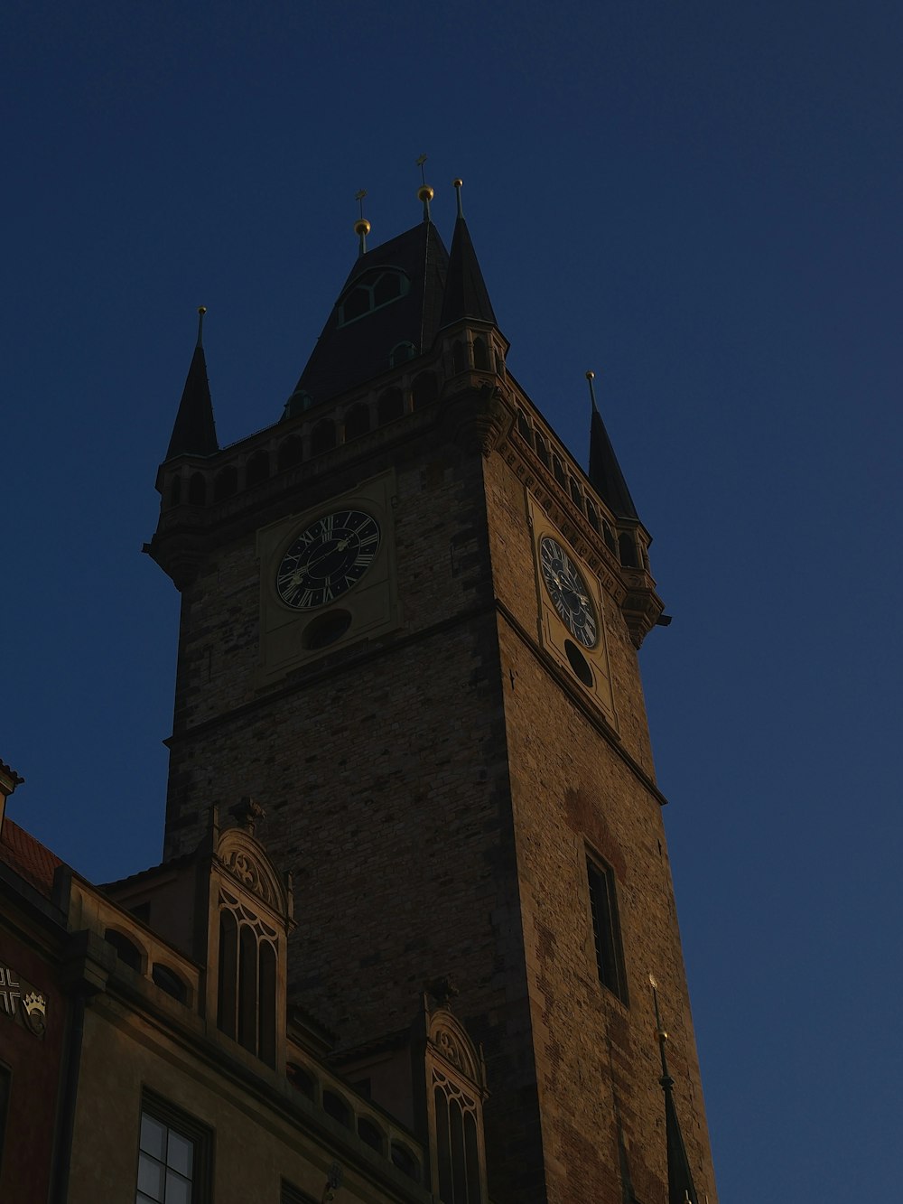 a tall clock tower with a clock on each of it's sides