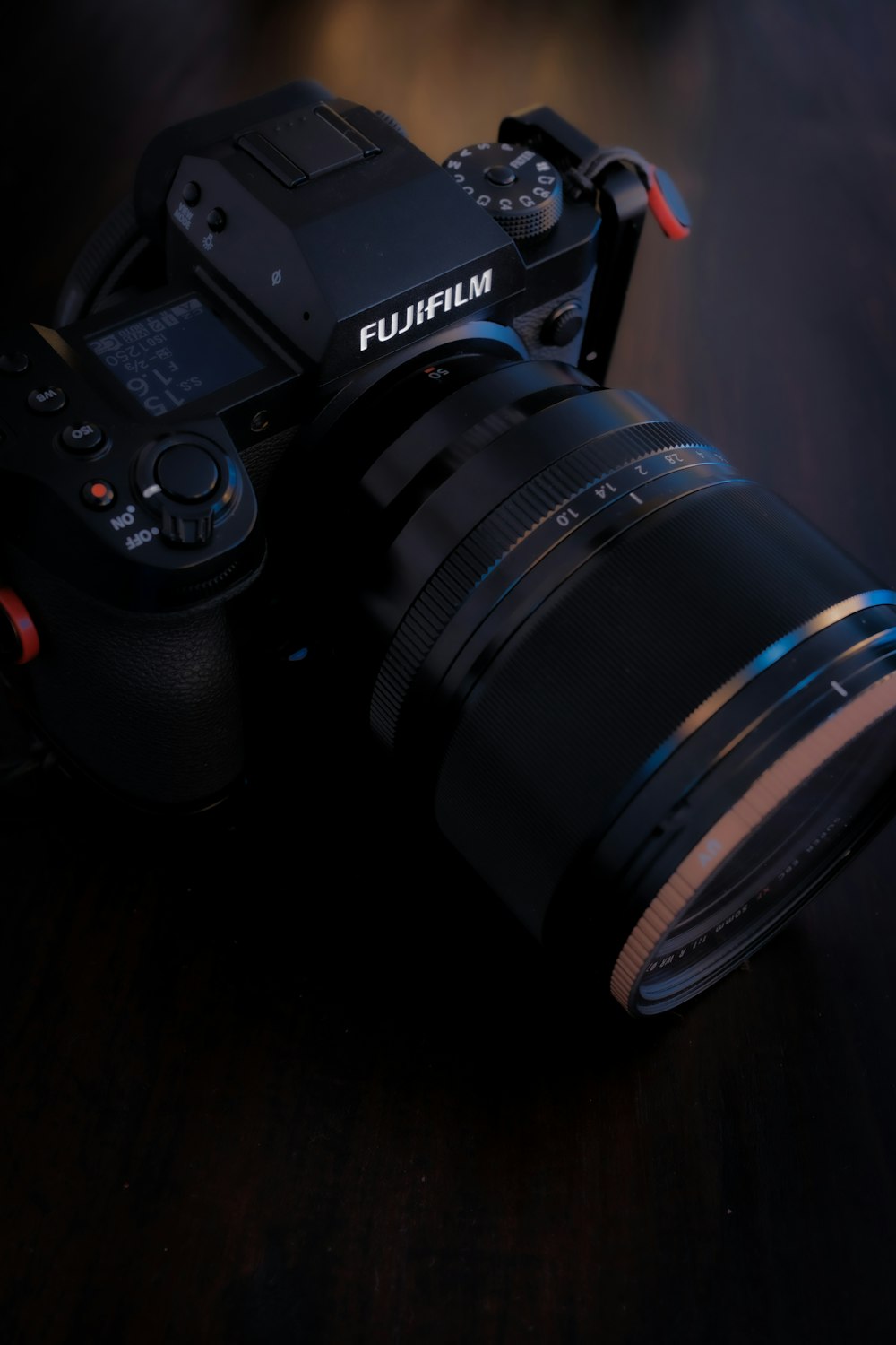 a camera sitting on top of a wooden table