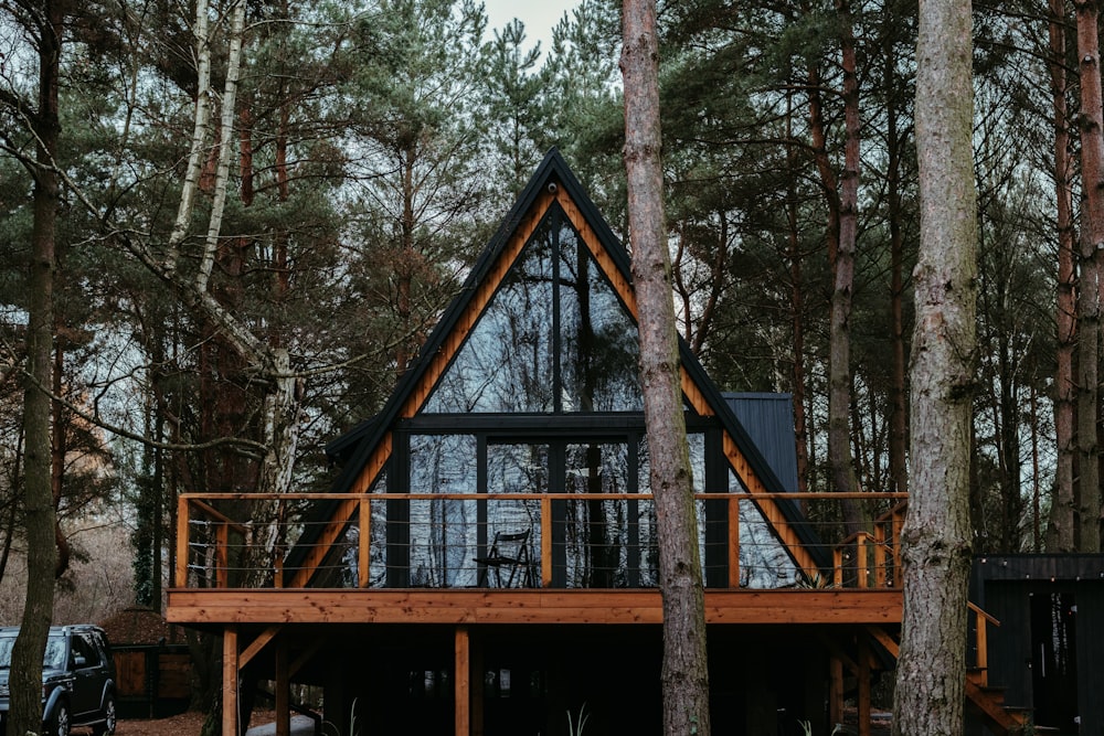 a cabin in the woods surrounded by trees