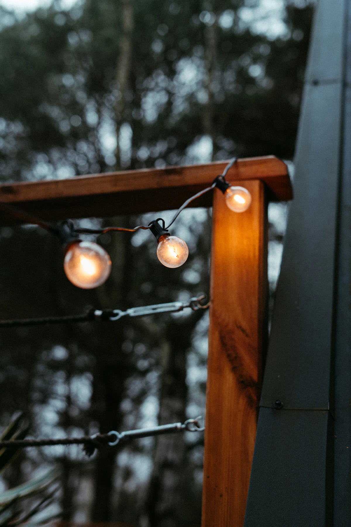 Layered outdoor lighting with path lights and a warmly lit facade