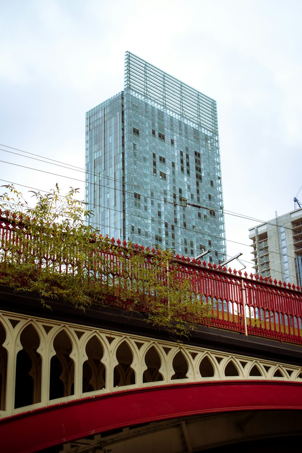 a bridge with a building in the background