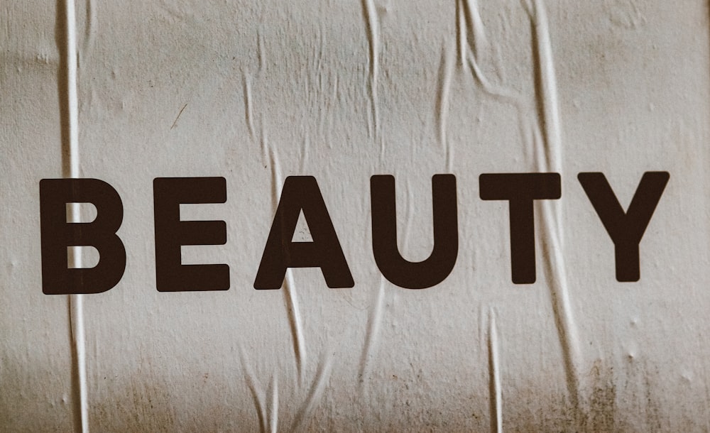 a close up of the word beauty on a piece of paper