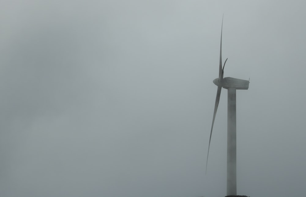 a wind turbine on a foggy day