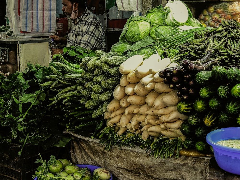 a large pile of vegetables sitting on top of a table