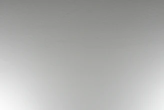 Top view showing the mattress surface with a subtle, elegant pattern.