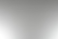 Before and after shot of a commercial interior wall, showing popcorn ceiling removal and fresh knockdown finish.