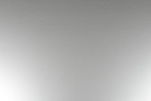 Close-up of a freshly painted ceiling with clean, sharp edges.