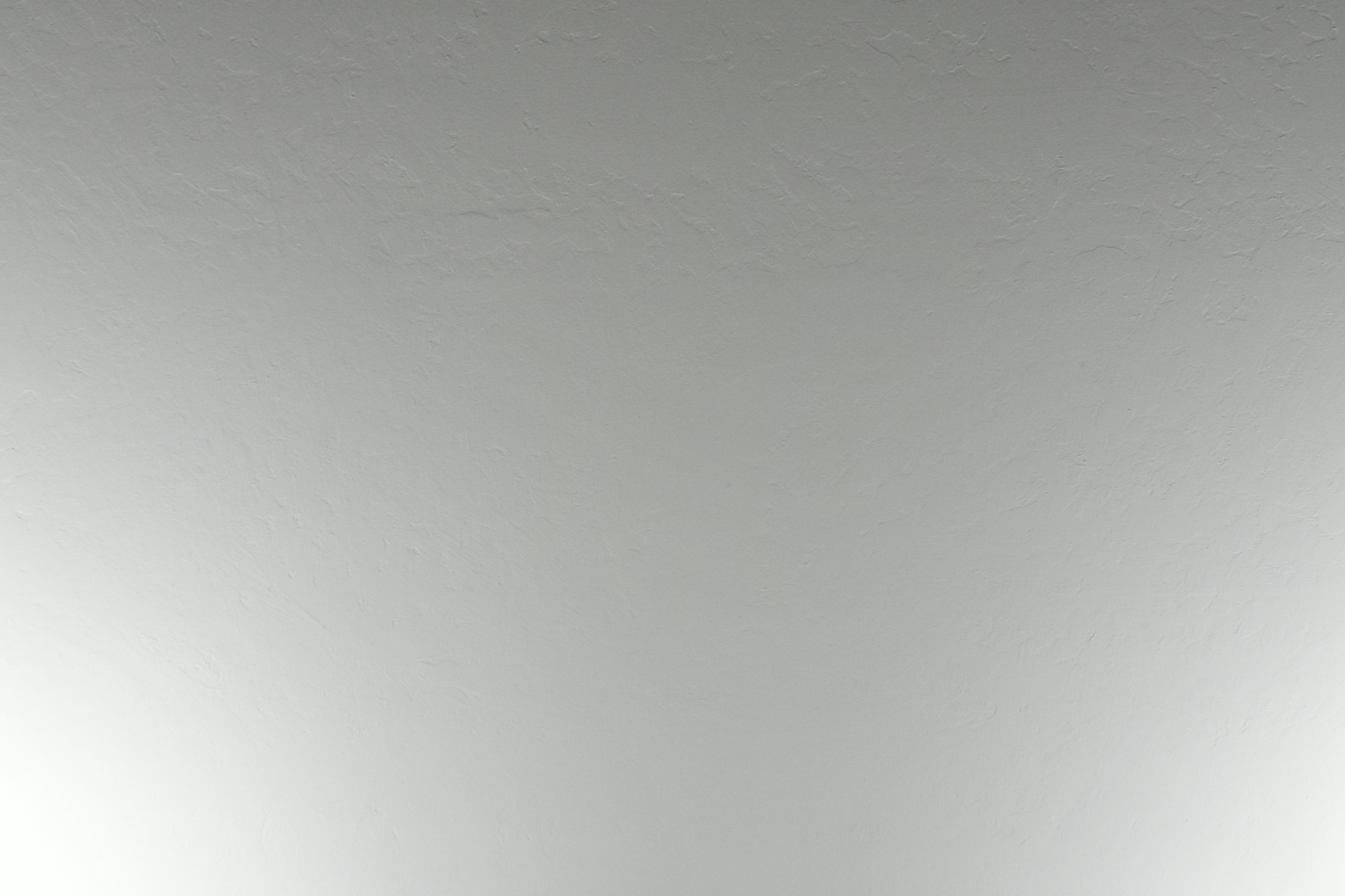 woman wearing yellow long-sleeved dress under white clouds and blue sky during daytime