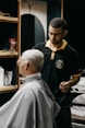 a man getting his hair cut by a barber