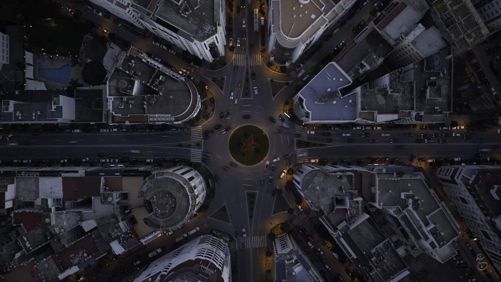 an aerial view of a city intersection at night