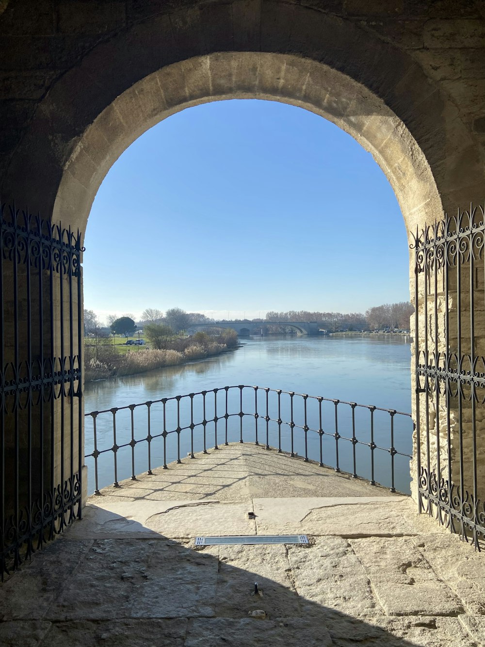 a view of a body of water through a gate