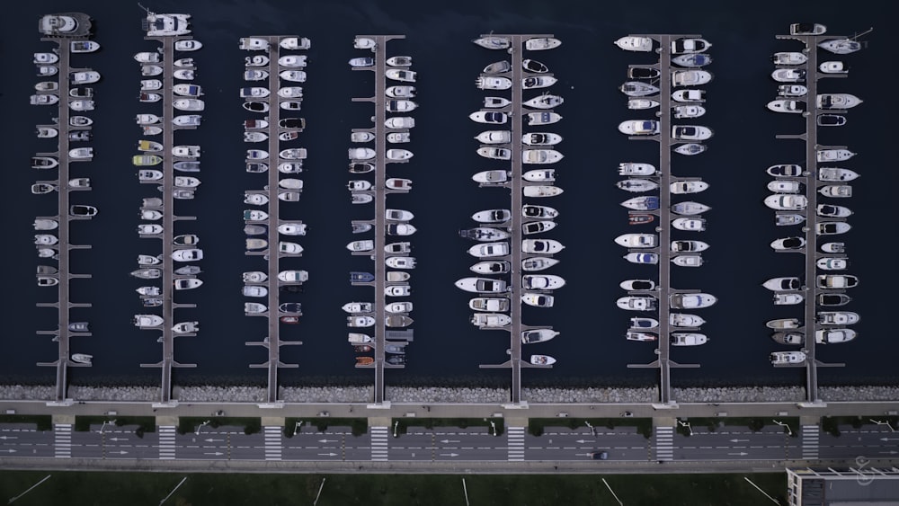 a bunch of boats are parked in a parking lot