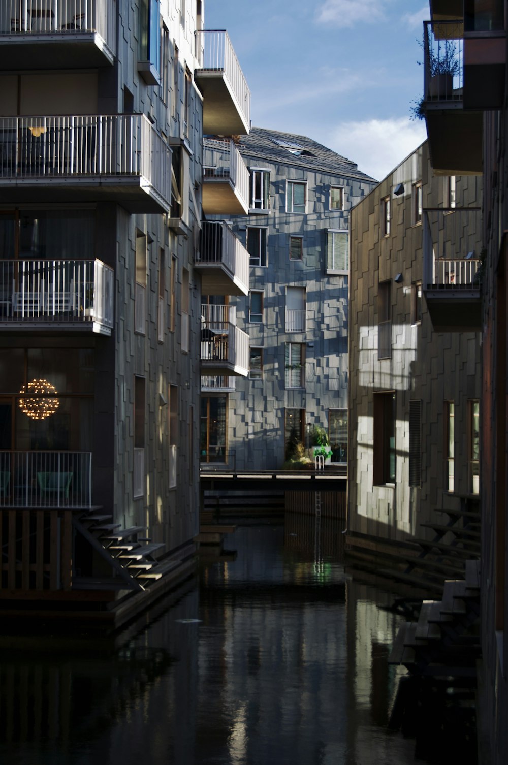 a river running through a city next to tall buildings