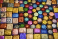 Tokens arranged in a creative layout, highlighting their unique shapes and finishes.