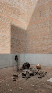 An installation piece blending natural elements with urban debris in a forgotten corner.