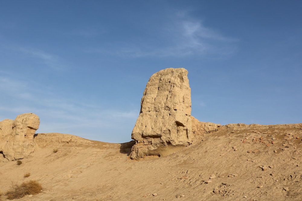 a rock formation in the middle of a desert