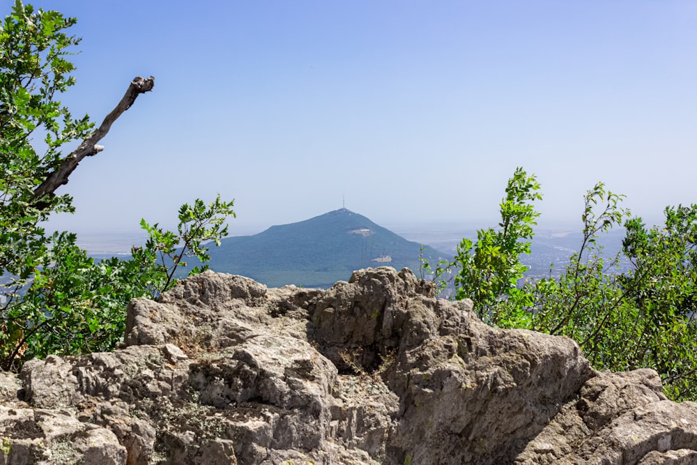 a view of a mountain from a rocky outcropping