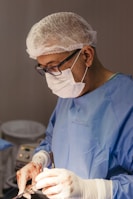 A close-up of a surgeon interacting with AI-assisted tools.