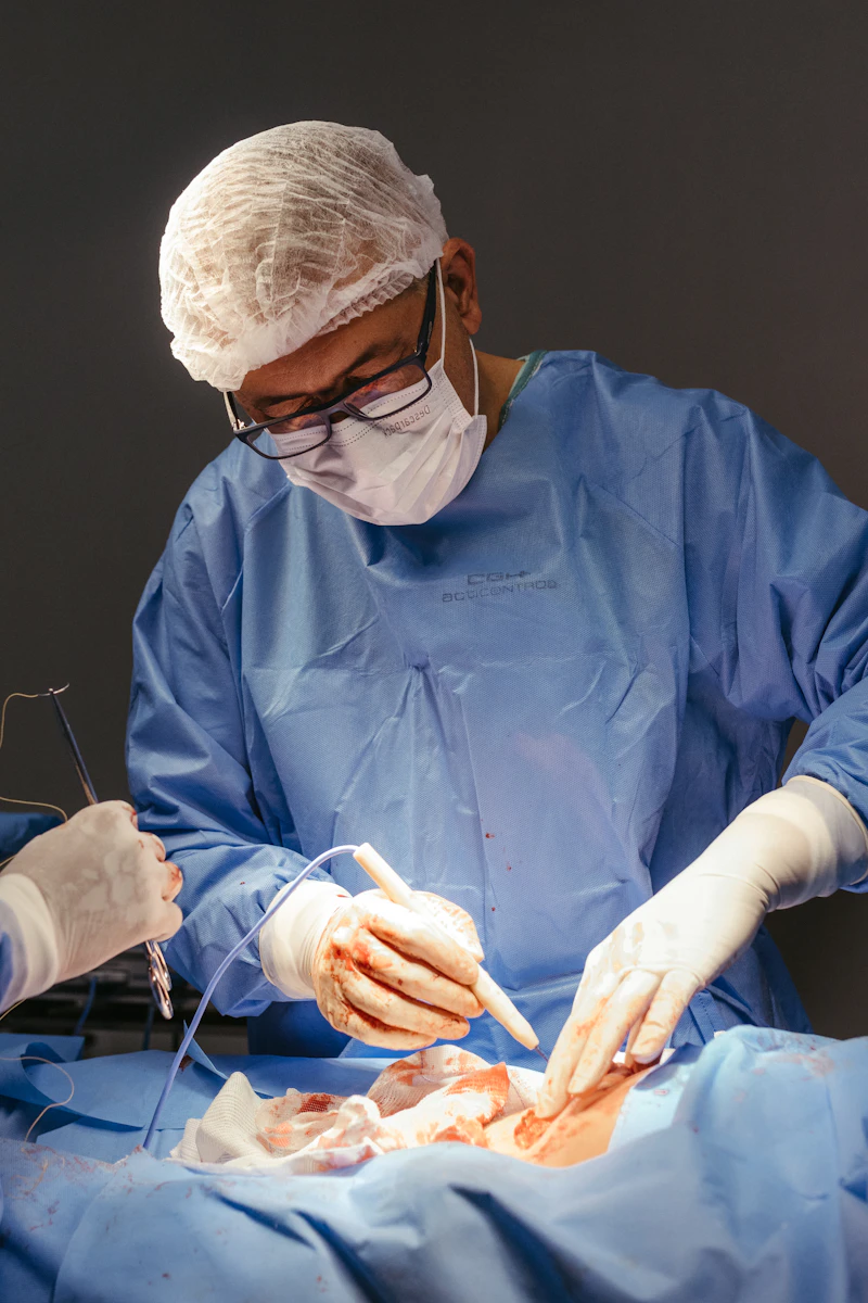 Surgeon performing minimally invasive laparoscopic surgery in an operating room