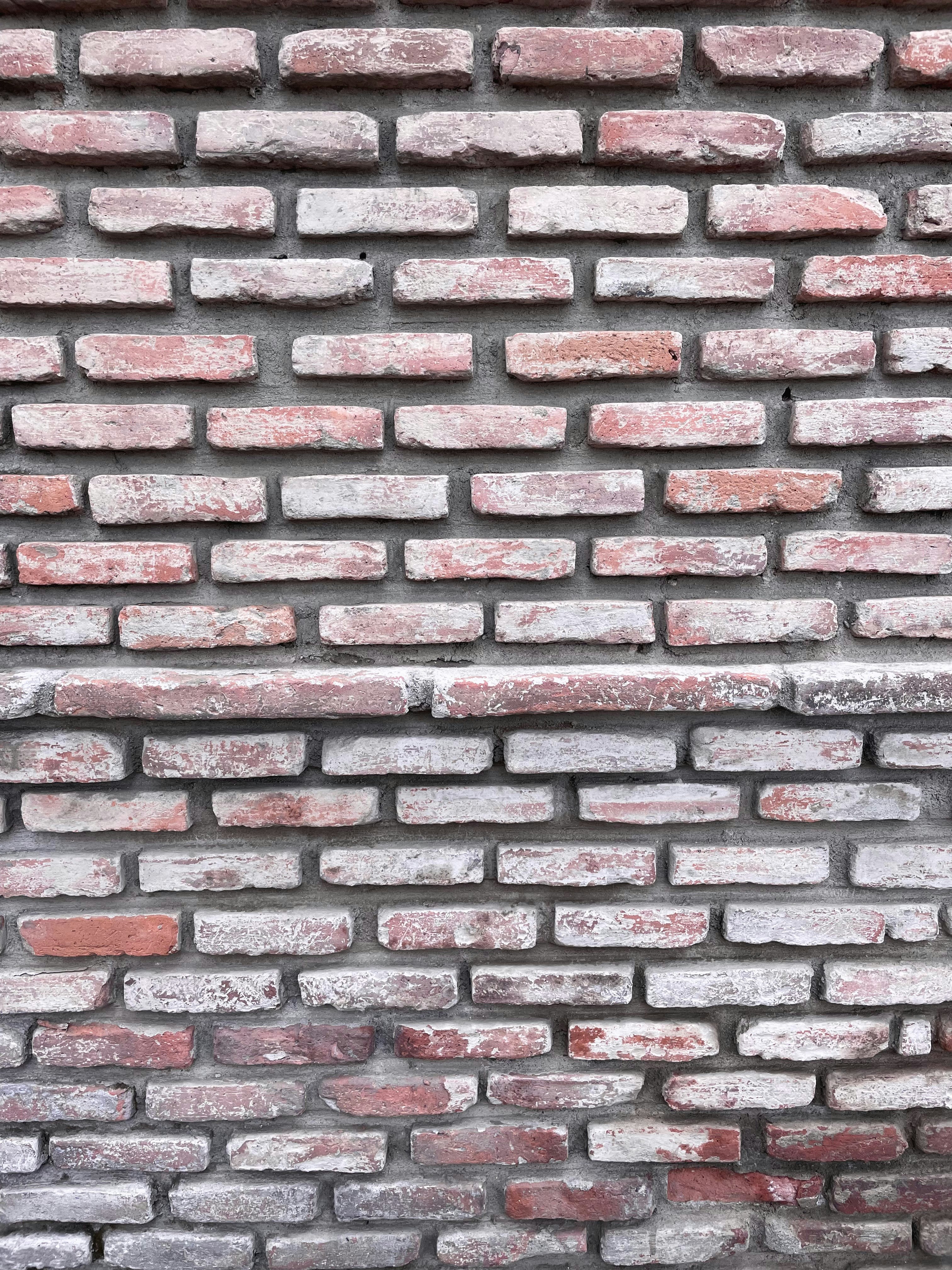 A close up of a brick wall made of bricks photo Free Brick wall Image