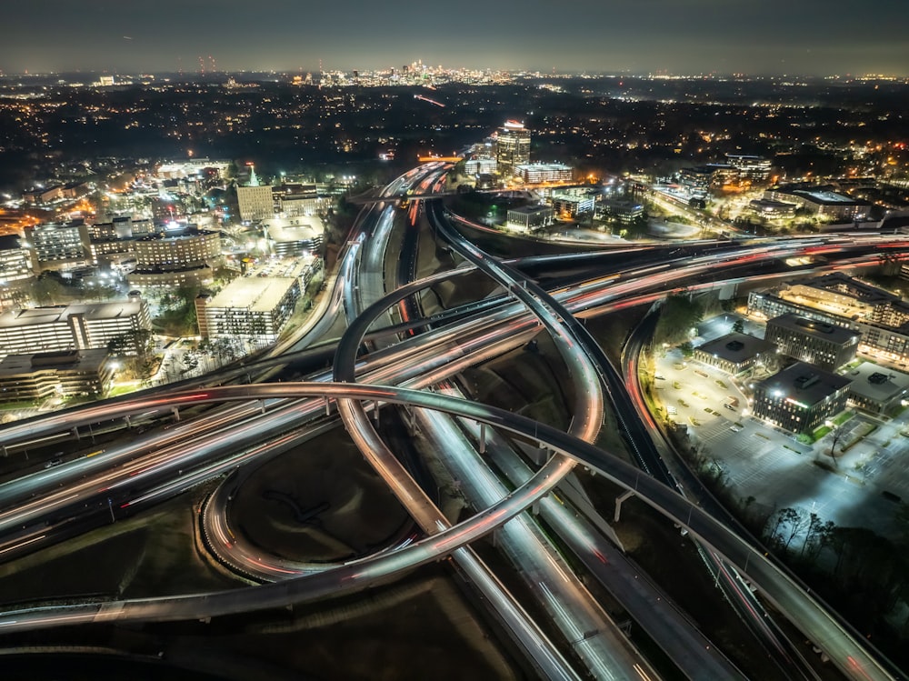 an aerial view of a highway intersection at night