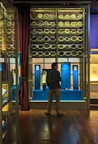 Venerable Soepa carefully examining a fragile scroll in a dimly lit monastery archive.