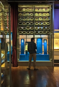 Ancient Persian scrolls and manuscripts spread on a wooden table.