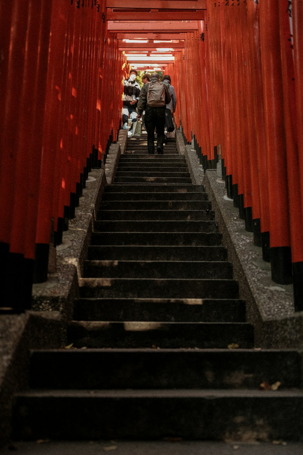 a group of people walking down a flight of stairs