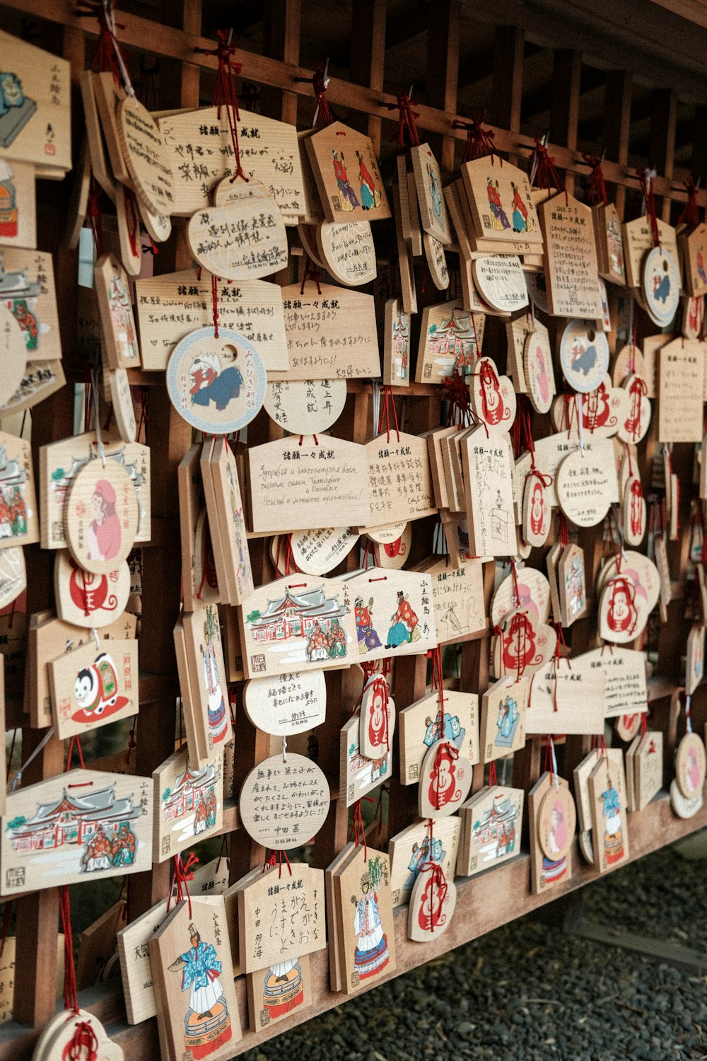 a wall covered in lots of wooden plaques