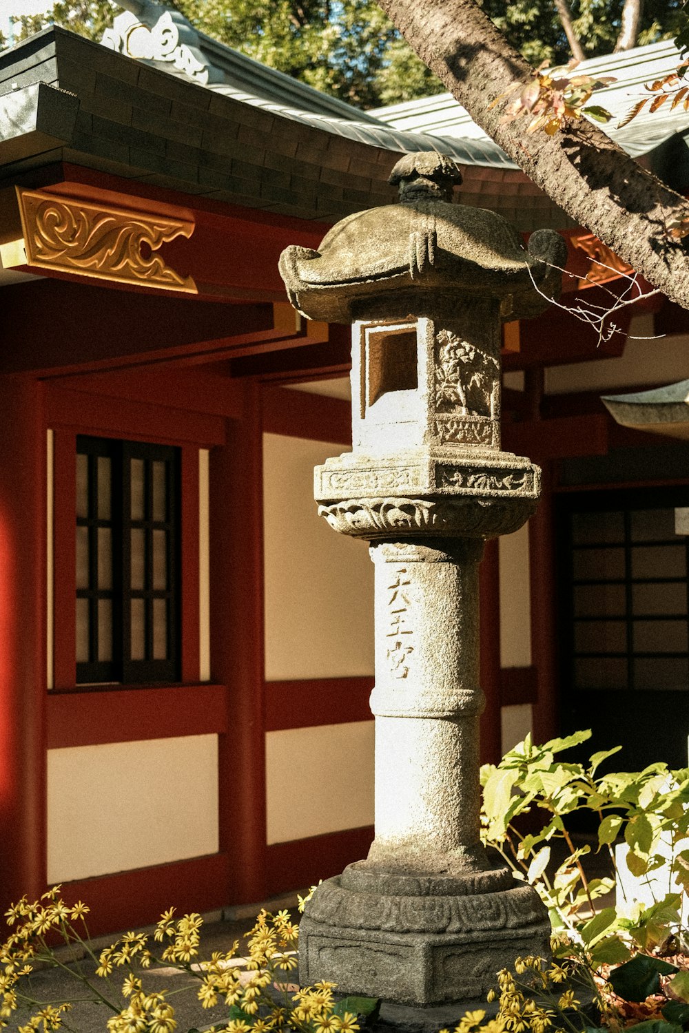 a stone lantern in front of a building