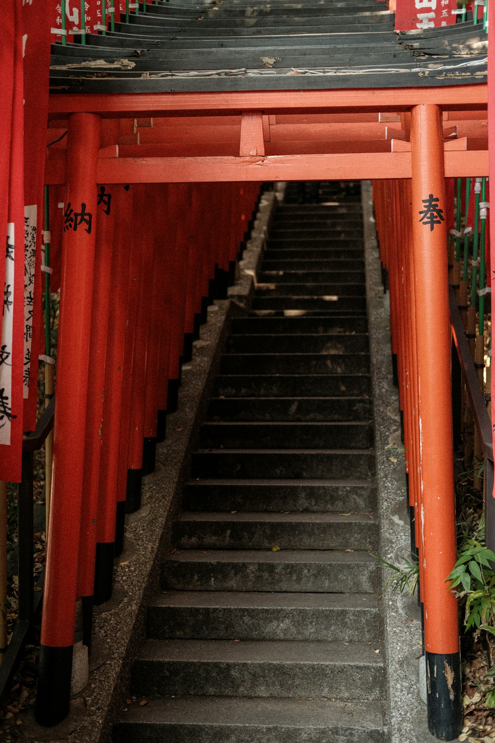 a staircase leading up to a red building