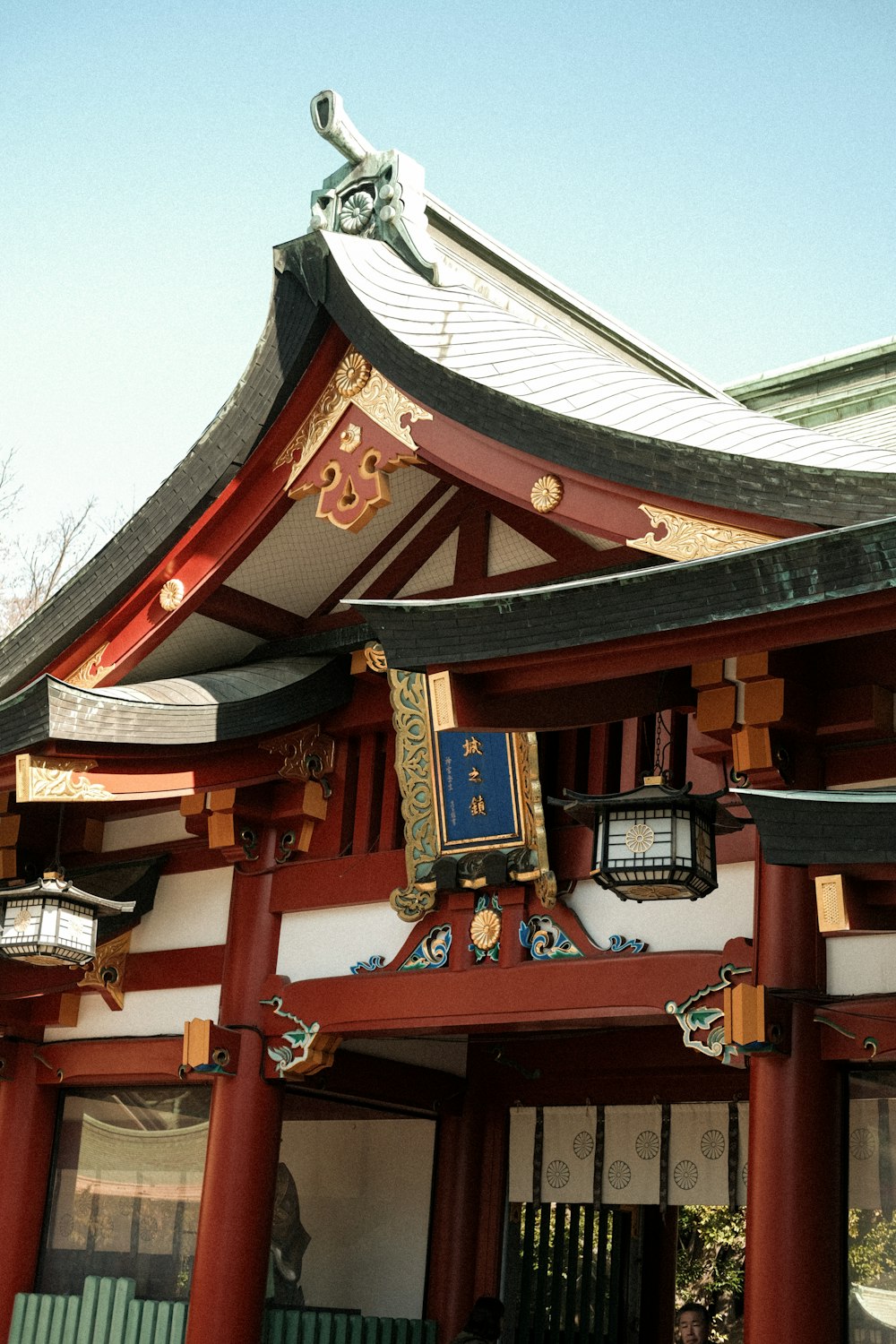 a red and white building with a clock on it's side