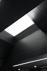 Minimalist office ceiling with clean lines and hidden fixtures