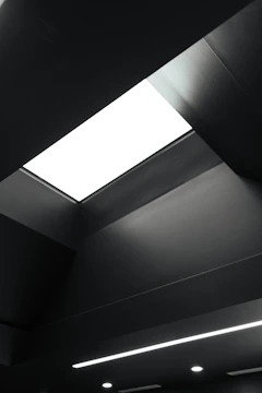 Minimalist office ceiling with clean lines and hidden fixtures