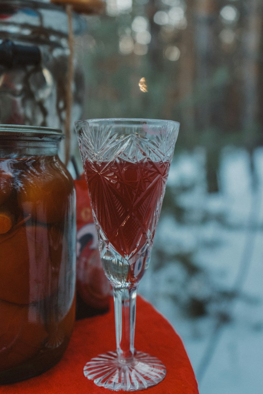 a glass of liquid sitting on top of a table