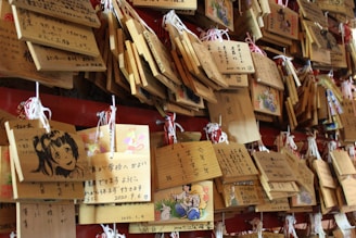 a wall covered in lots of wooden signs