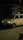 Nighttime locksmith service van parked outside a residential building.